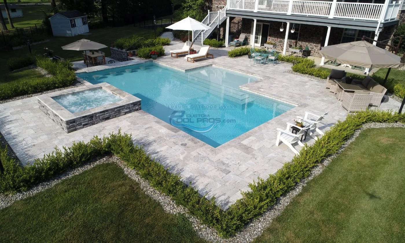 rectangular style inground pool with spa and sun tanning ledge, inground pool